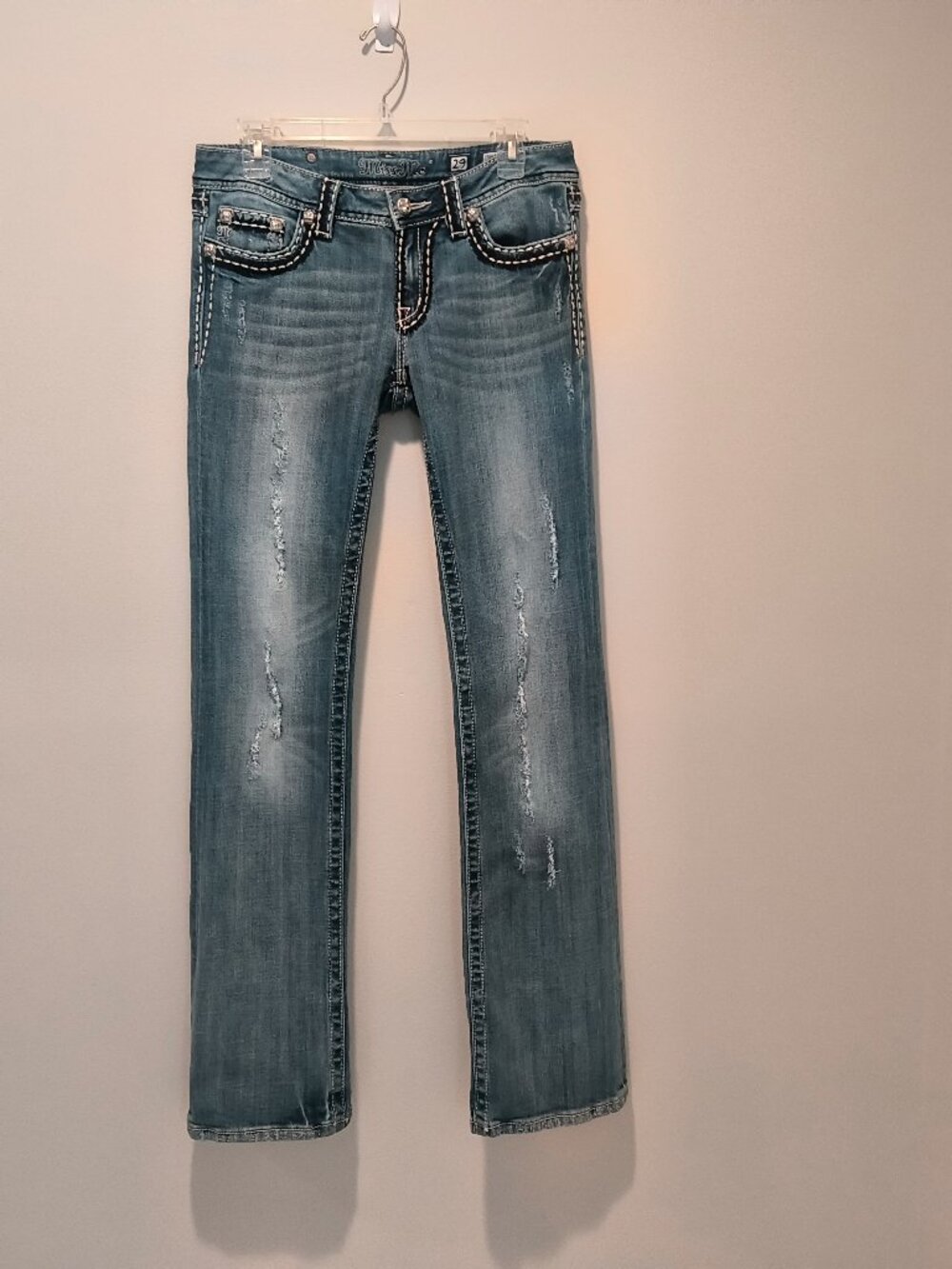 Miss Me jeans featuring distressed denim, size 29